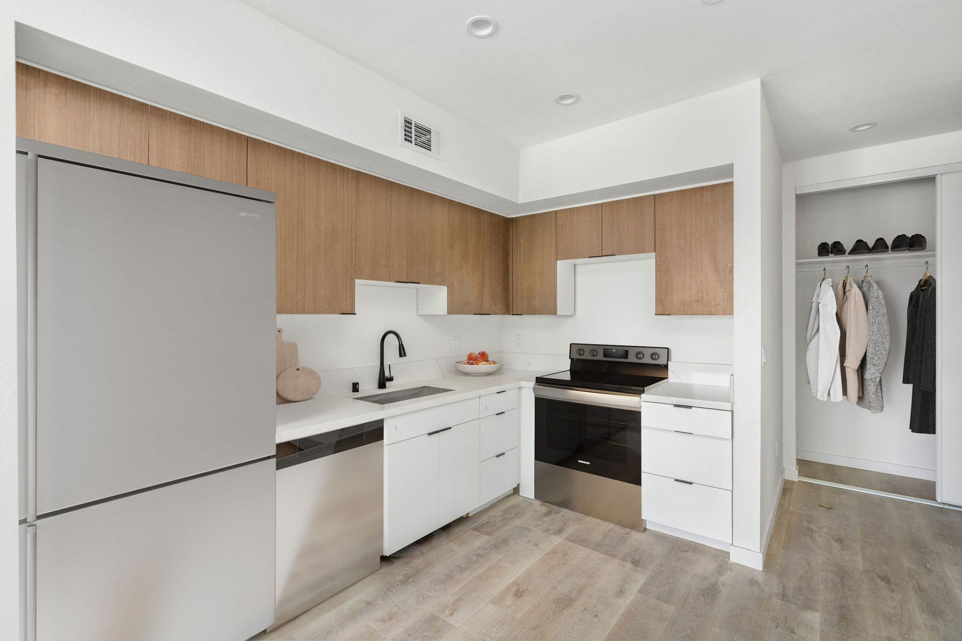 Clean contemporary kitchen with warm wood cabinetry