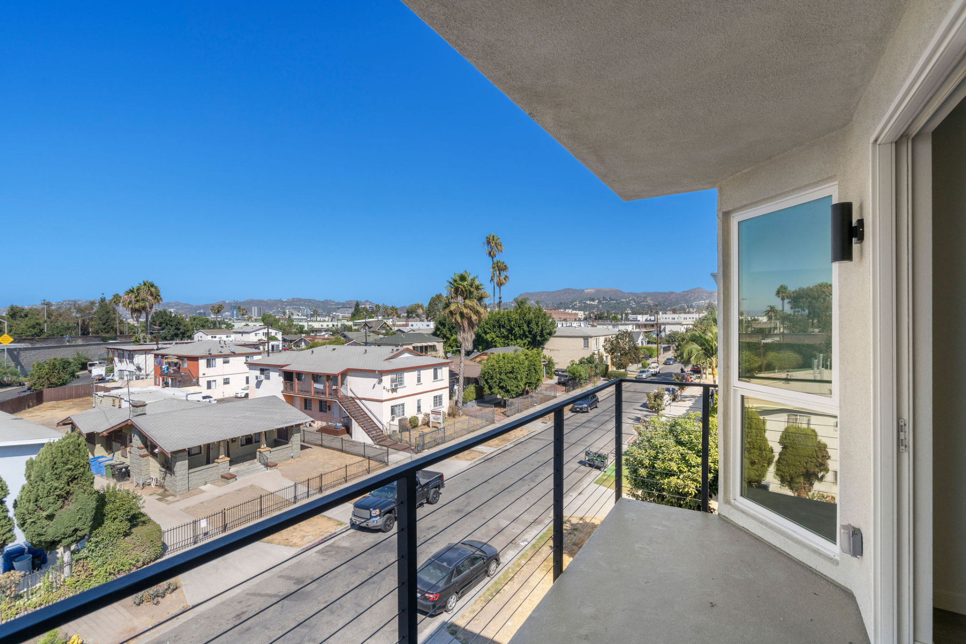Private balcony with open views toward the Hollywood Hills